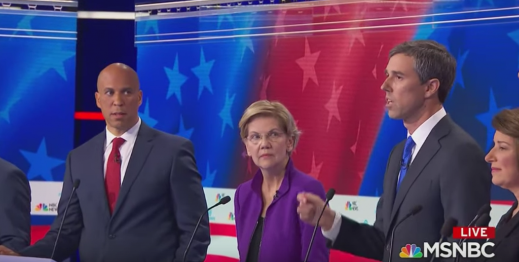 Corey Booker giving Beto the side-eye as the latter got to speak terribly in Spanish before the former